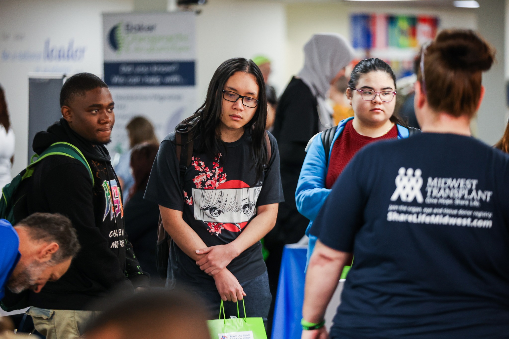 Students looking at information booths at a health fair.