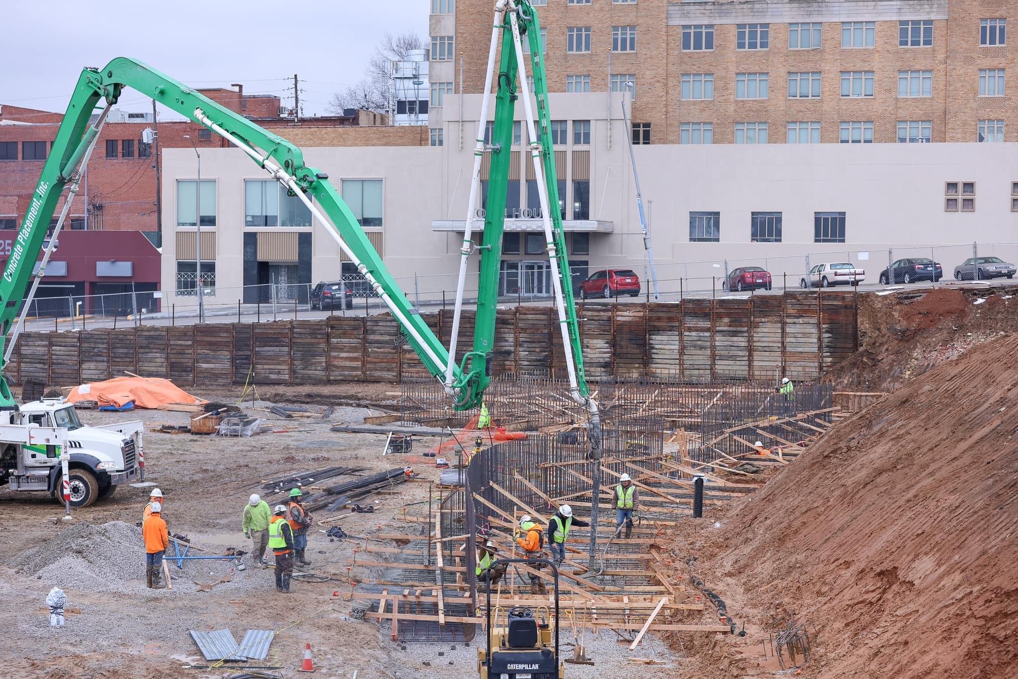 Construction crew pouring concrete.