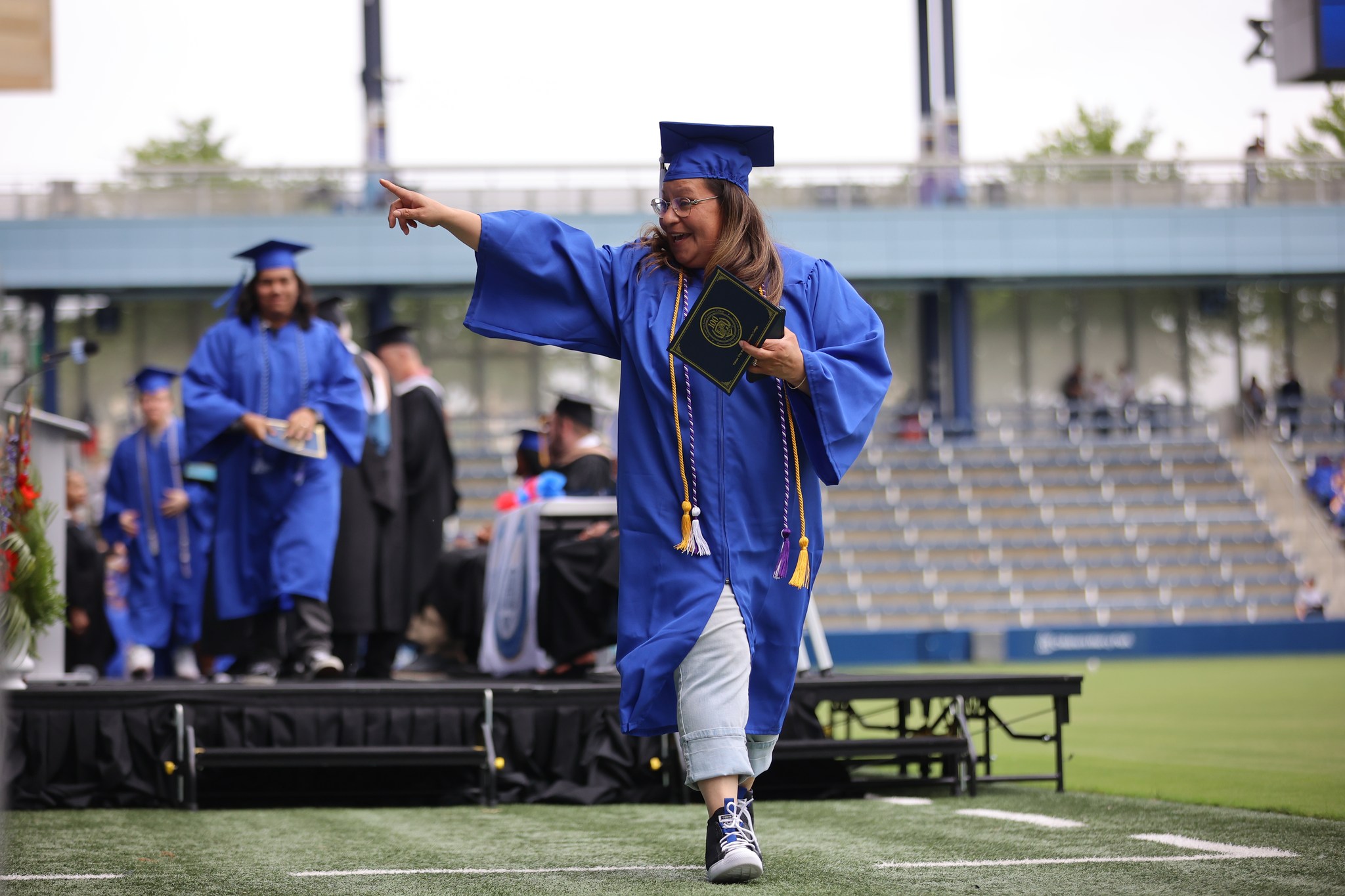 Graduate walking across stage.