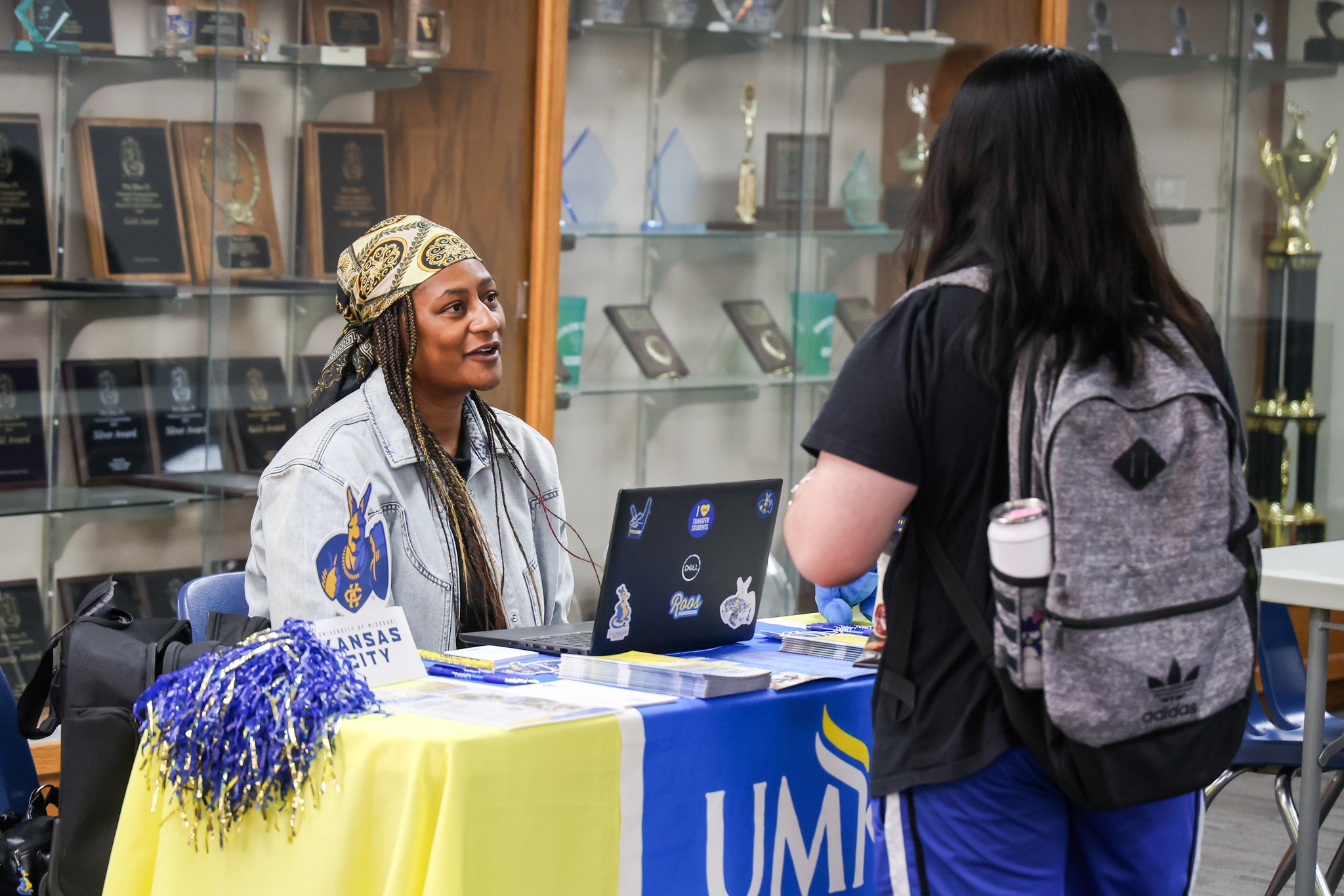 Student talking to woman.