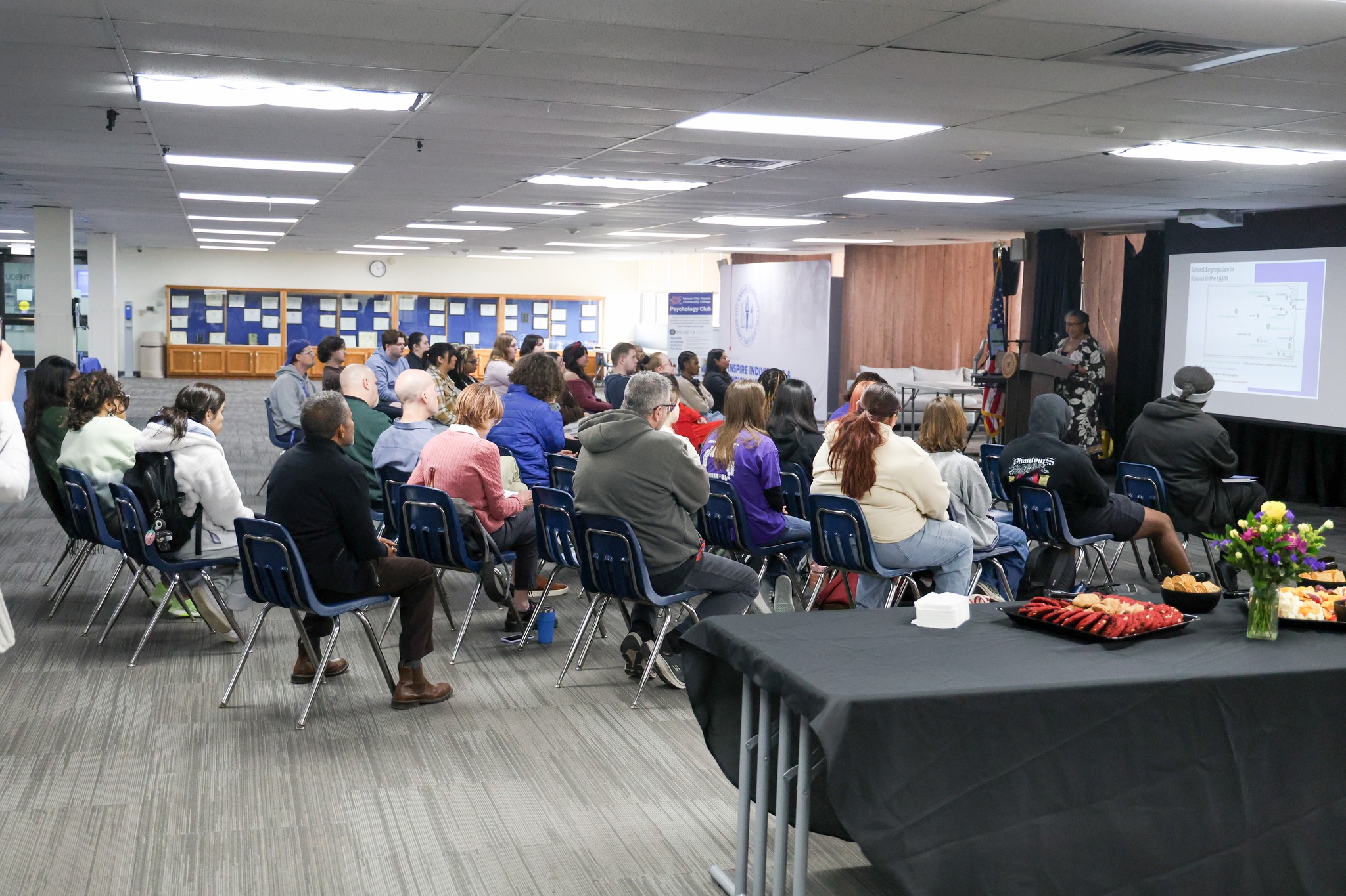 Group of students listening to speaker.