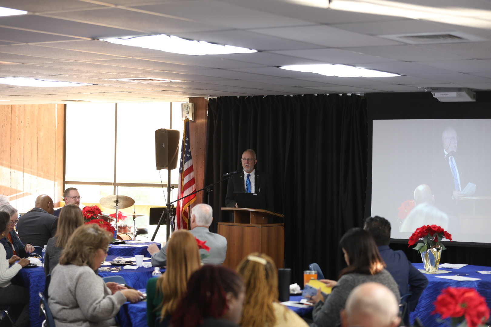 KCKCC President Dr. Greg Mosier speaking to a crowd of people.