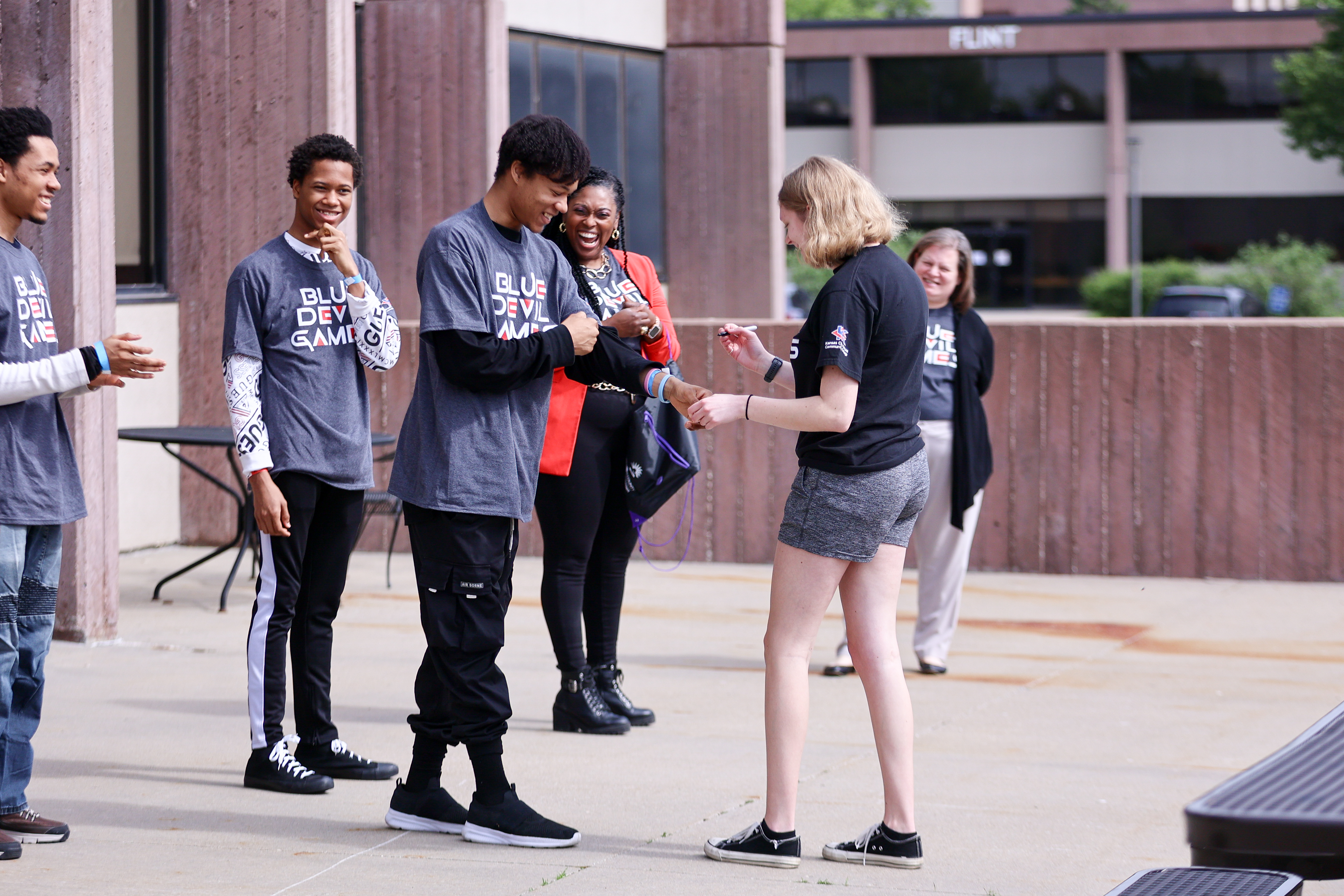 Group of people playing games outside.
