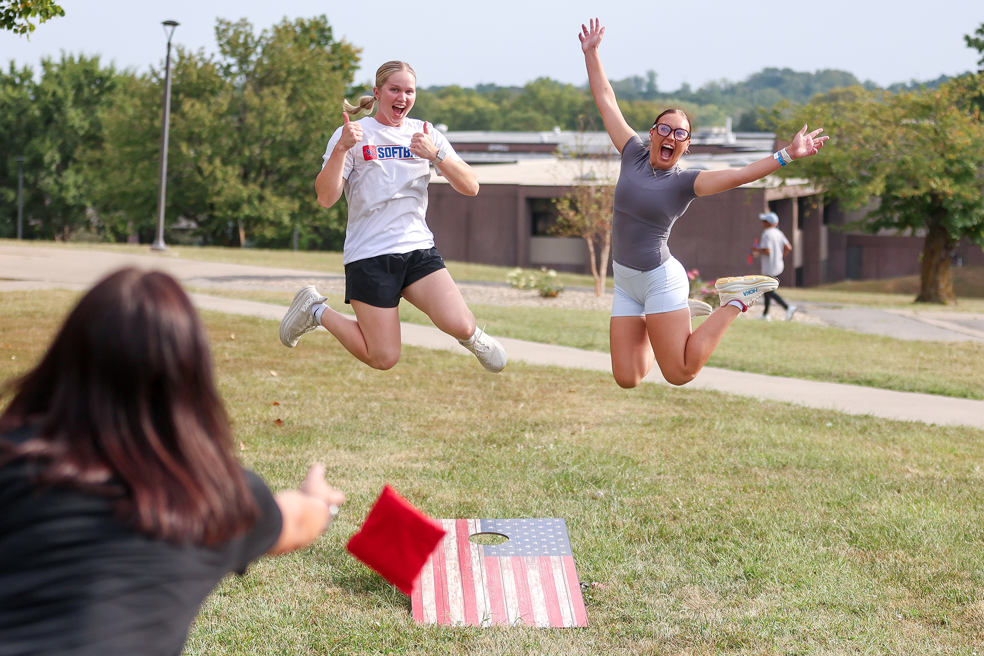 Two girls jumping in the air.