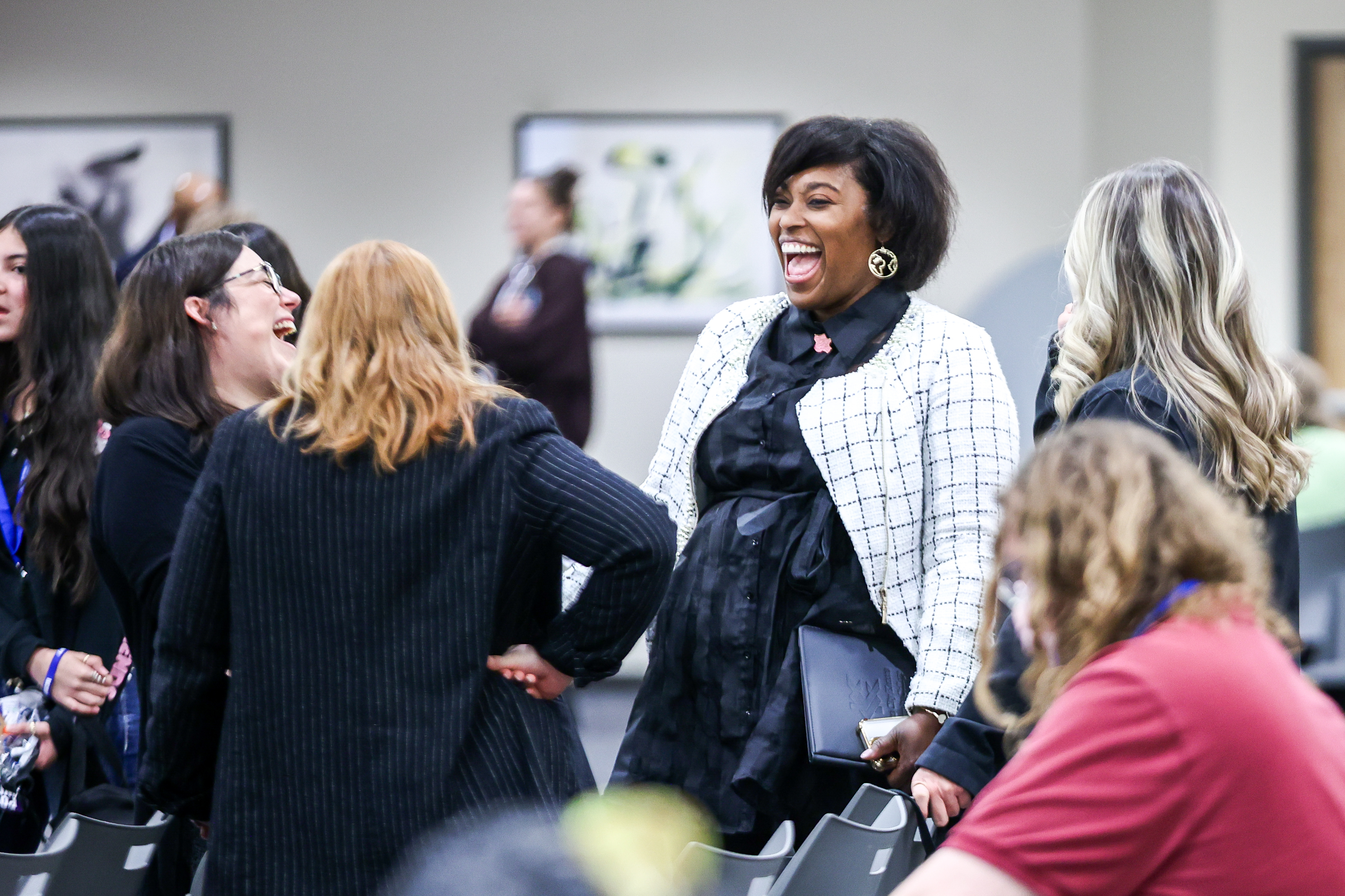 Group of women laughing together.